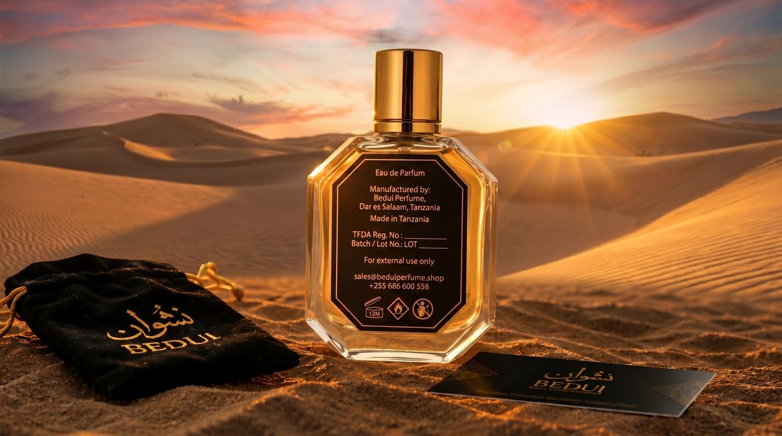BEDUI octagonal bottle back label showing Made in Tanzania — Eau de Parfum — on sandy desert surface